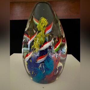 Vintage solid glass blown oval shaped sculpture with vibrant swimming fish